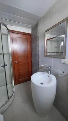 a bathroom with a white sink and a mirror at Blue apt H1 - two queen bedroom - POOL- in Sosúa