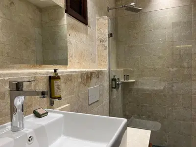 a bathroom with a sink and a shower at Boutique Hotel Casa Grande, Mandala Suite in Santo Domingo