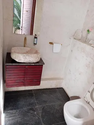 a bathroom with a sink and a toilet at Boutique Hotel Casa Grande, Mandala Suite in Santo Domingo