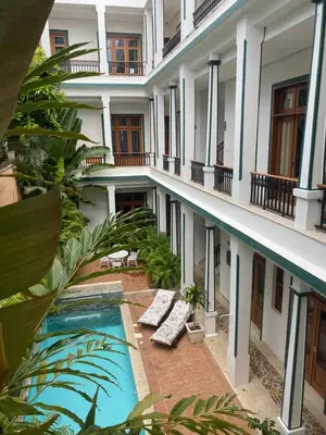 a view of the courtyard of a building with a swimming pool at Boutique Hotel Casa Grande, Banana Chica, Estudio superior con cocina in Santo Domingo