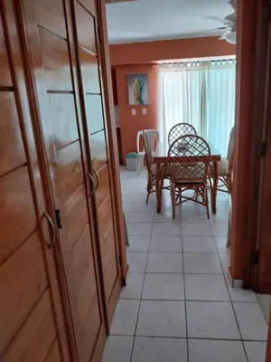 a room with a table and chairs and a dining room at Edificio maremma 6 in Boca Chica