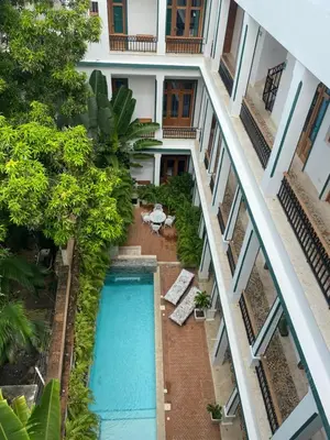 an overhead view of a swimming pool in a building at Boutique Hotel Casa Grande, Dominican Voyage, Suite familiar de 2 dormitorios in Santo Domingo