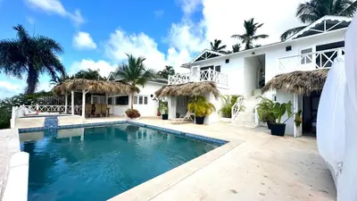 a swimming pool in front of a house at Villa Blanca, Las Terrenas, 4 chambres in Las Terrenas