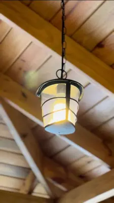 a light hanging from the ceiling of a house at Villas Gabriel in Nagua