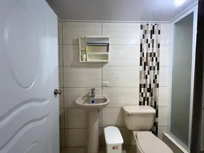 a small bathroom with a toilet and a sink at Apartamento Costero 1 en Las Galeras in Las Galeras