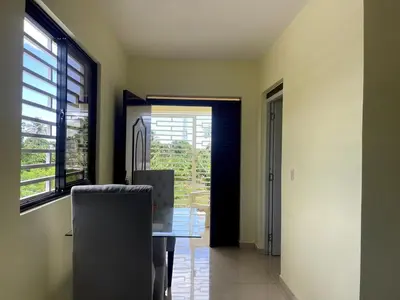 a dining room with a table and a window at Apartamento Costero 2 en Las Galeras in Las Galeras
