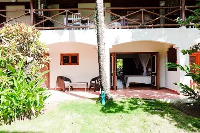 a view of a bedroom in a villa at Lovely Beach Apartment in Tranquil Playa Bonita in Las Terrenas