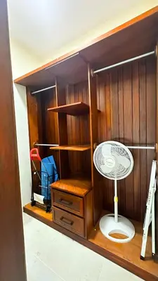 a room with a book shelf and a fan at Eden Caribe Condo, Bavaro Punta Cana in Punta Cana