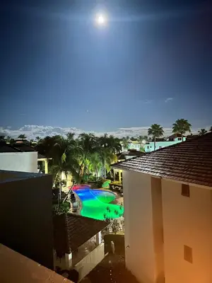 a view of a swimming pool from a building at Eden Caribe Condo, Bavaro Punta Cana in Punta Cana