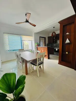a kitchen and dining room with a table and chairs at Eden Caribe Condo, Bavaro Punta Cana in Punta Cana