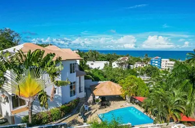 an aerial view of a house and a swimming pool at Villa with Oceanviews for All Types of Travelers in San Felipe de Puerto Plata