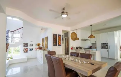 a kitchen and dining room with a table and chairs at Villa with Oceanviews for All Types of Travelers in San Felipe de Puerto Plata