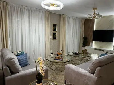 a living room with two couches and a table at Modern Colonial Water View in Calero