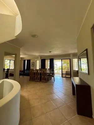 a living room with a tub and a dining room at CASA Angelo in Sosúa
