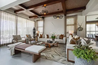 a living room with a couch and a table at Villa Barbara, serviced accommodation in the heart of Puntarena beach club in Sabana Buey
