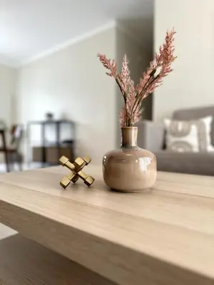 a vase and two crosses sitting on a table at Belive 01 Condo in Santiago, the heart of the city in Santiago de los Caballeros
