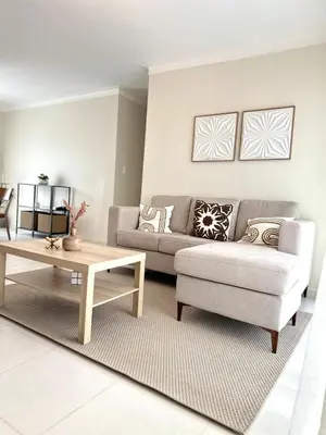 a living room with a couch and a coffee table at Belive 01 Condo in Santiago, the heart of the city in Santiago de los Caballeros