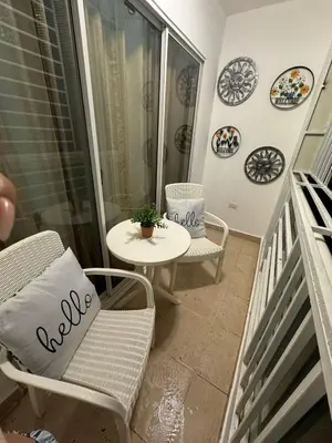 a balcony with a table and a chair and a table at Sweet dreams Tropical paradise in San Isidro