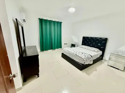 a bedroom with a bed and a green curtain at corales apartamento lll in La Viva