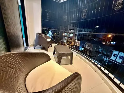 a balcony with chairs and a view of a city at corales apartamento lll in La Viva