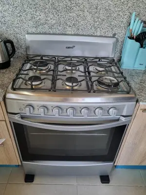 a stove top oven sitting on top of a counter at Apartment w private terrace and Jacuzzi in Las Terrenas