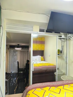 a bedroom with a bunk bed in a room at Escape en terrazas del caribe con psicina y playa in Boca Chica