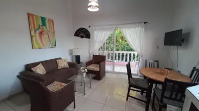a living room with a couch and a table at Apartamento de 2 habitaciones in Colorado