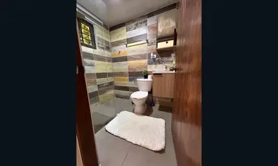 a bathroom with a toilet and a sink at Casa Estrellita-Romantic getaway in Santo Domingo