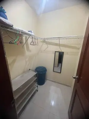 a walk in closet with a bench in a room at Beautiful accommodation in Los Paredones