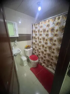 a bathroom with a toilet and a shower curtain at Beautiful accommodation in Los Paredones
