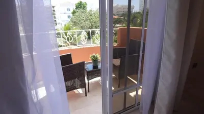 a balcony with a table and chairs on a balcony at Juan Dolio Near Beach, Pool Cozy Stay in Villas del Mar