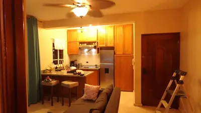 a living room with a couch and a kitchen at Juan Dolio Near Beach, Pool Cozy Stay in Villas del Mar