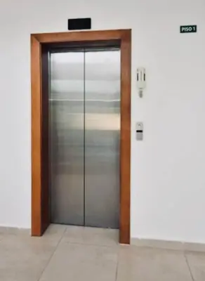 a metal elevator door in a building at Paraíso encantado Juan Dolio, Confort y Seguridad in Villas del Mar