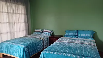 two beds sitting next to each other in a bedroom at Villa Sol de Campo in Las Galeras