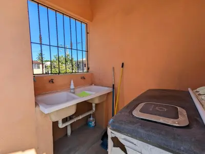 a small bathroom with a sink and a window at Buenos Aires Apartments in Río San Juan