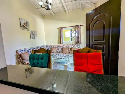 a living room with two chairs and a couch at Buenos Aires Apartments in Río San Juan
