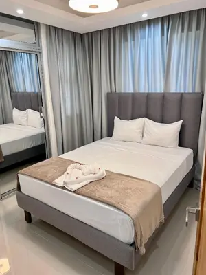 a bedroom with a large bed in front of a window at Sky Golden in Los Altos de Jalisco