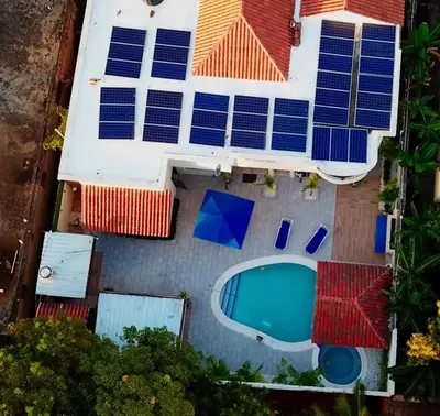 an overhead view of a house with solar panels on its roof at Villa La Dueña - Vista Hermosa Luxury Retreat, 5BR Villa with Pool, Swim-Up Bar, Jacuzzi, Chef's Kitchen, Fast Wi-Fi, Full AC, EV Charger and Solar Power, Ideal for Families & Groups in Cancino