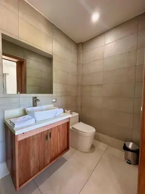 a bathroom with a sink and a toilet at Refugio Verde Las Terrenas in Las Terrenas