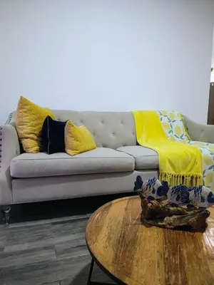 a living room with a couch and a coffee table at Sunflower Bayahibe with pool in Bayahibe