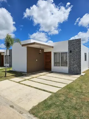 a small white house with a driveway at Paradise Escape Villa 201 2br Private Pool in Punta Cana