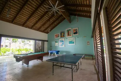 a ping pong room with a ping pong table in it at Coson Bay in Las Terrenas
