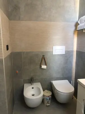 a small bathroom with a toilet and a bidet at Cozy 2 bedroom Beach Apto in Bayahibe