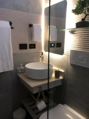 a bathroom with a white sink and a mirror at Cozy 2 bedroom Beach Apto in Bayahibe