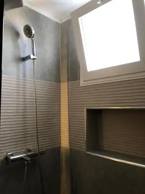 a shower in a bathroom with a window at Cozy 2 bedroom Beach Apto in Bayahibe