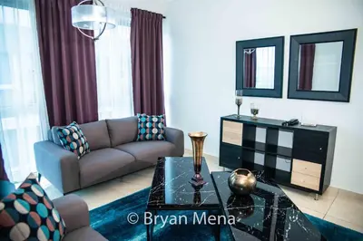 a living room with a couch and a table at Eclectic gorgeous, modern 3 levels penthouse in Santo Domingo