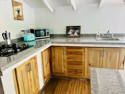 a kitchen with a sink and a counter top at The Coco Garden Cabin in Las Galeras