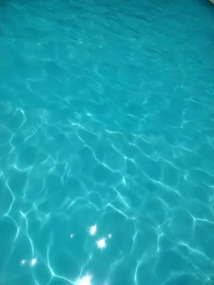 a close up of a pool of blue water at villas bahia in Sánchez