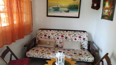 a living room with a couch and a table at villas bahia in Sánchez