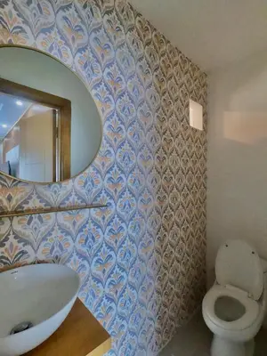 a bathroom with a sink and a mirror and a toilet at The Chic Hideout full apt in san isidro Terrace in Juan López